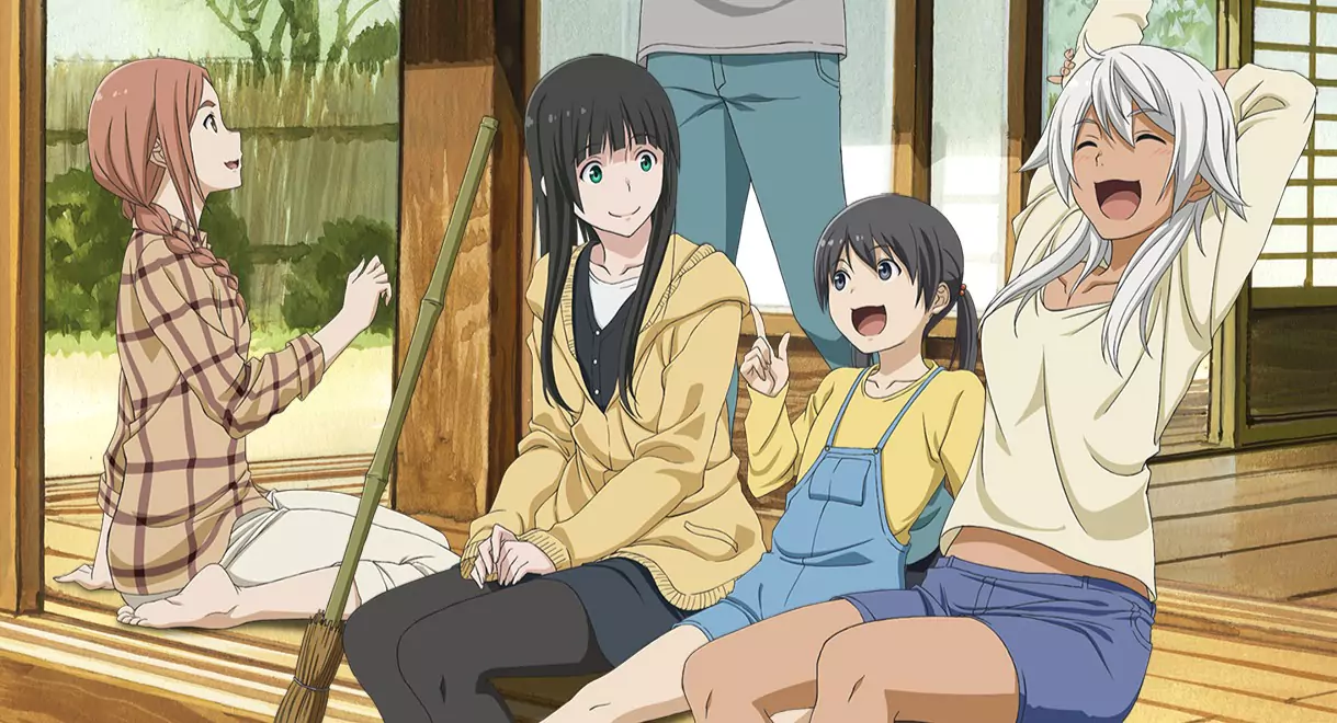 Makoto, Chinatsu, and Akane relaxing together in a cozy room, enjoying a peaceful moment in the Flying Witch anime.