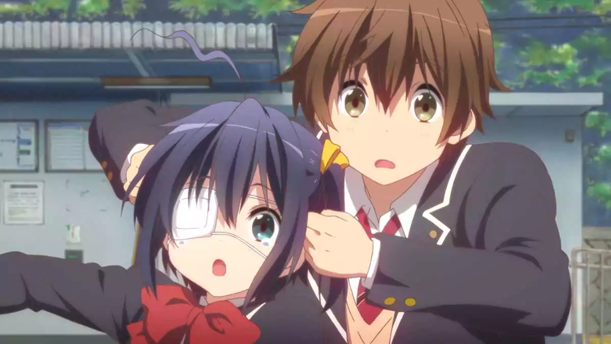 Yuuta holds Rikka close in a playful yet touching scene from Chunibyo & Other Delusions! blending comedy and affection.