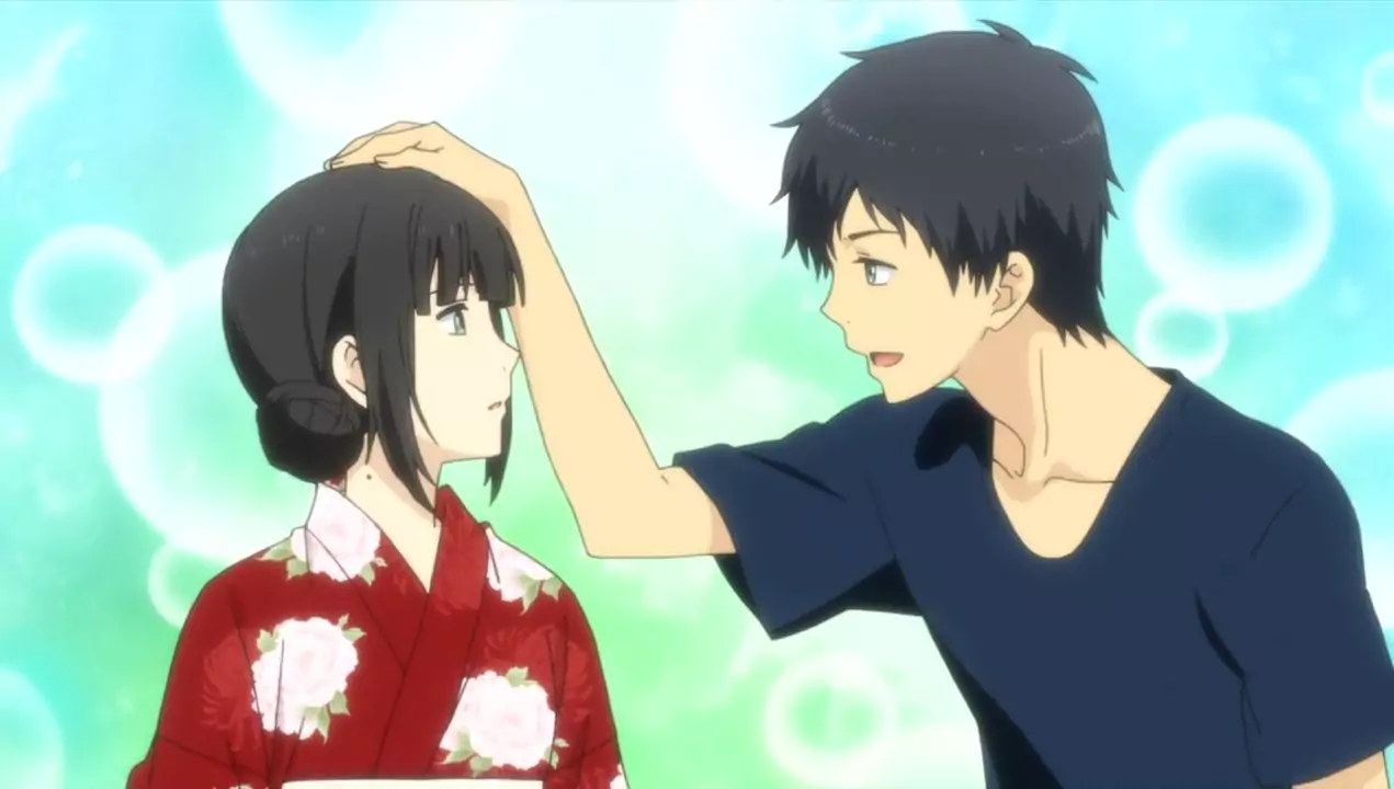 Arata gently pats Hishiro’s head in a tender scene from ReLIFE anime, capturing a sweet and heartfelt moment.
