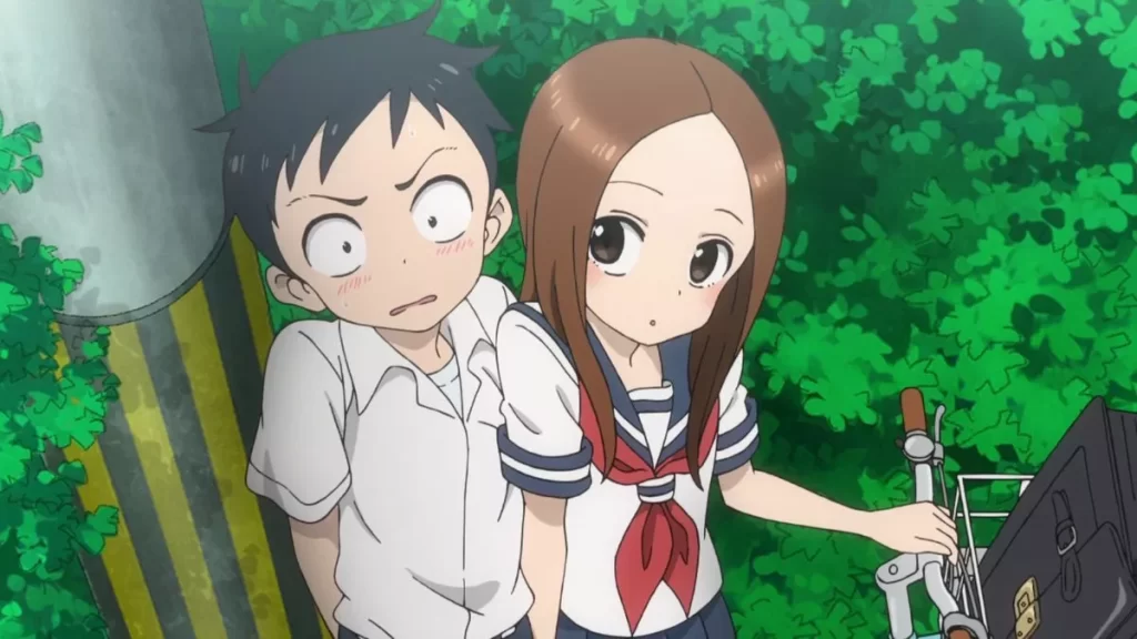 Takagi leans close to a flustered Nishikata in Teasing Master Takagi-san, capturing a playful moment