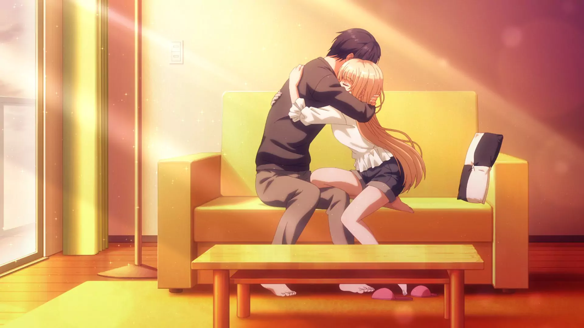 Amane hugs Mahiru tightly on the couch in a warm, emotional scene from The Angel Next Door Spoils Me Rotten anime.