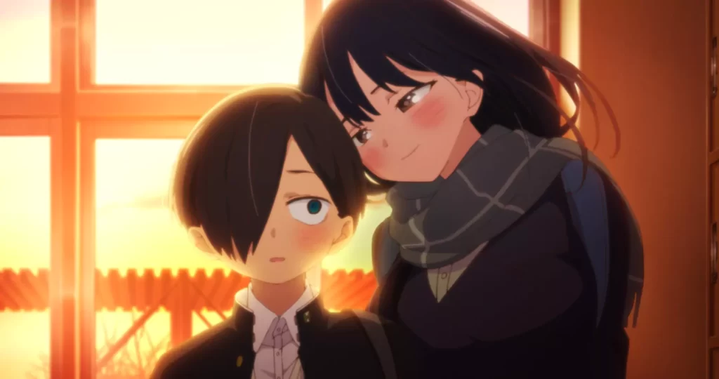A high school couple, Anna Yamada and Kyotaro Ichikawa shares a tender moment in a warm, sunlit classroom scene from the romance anime ‘The Danger in My Heart.’