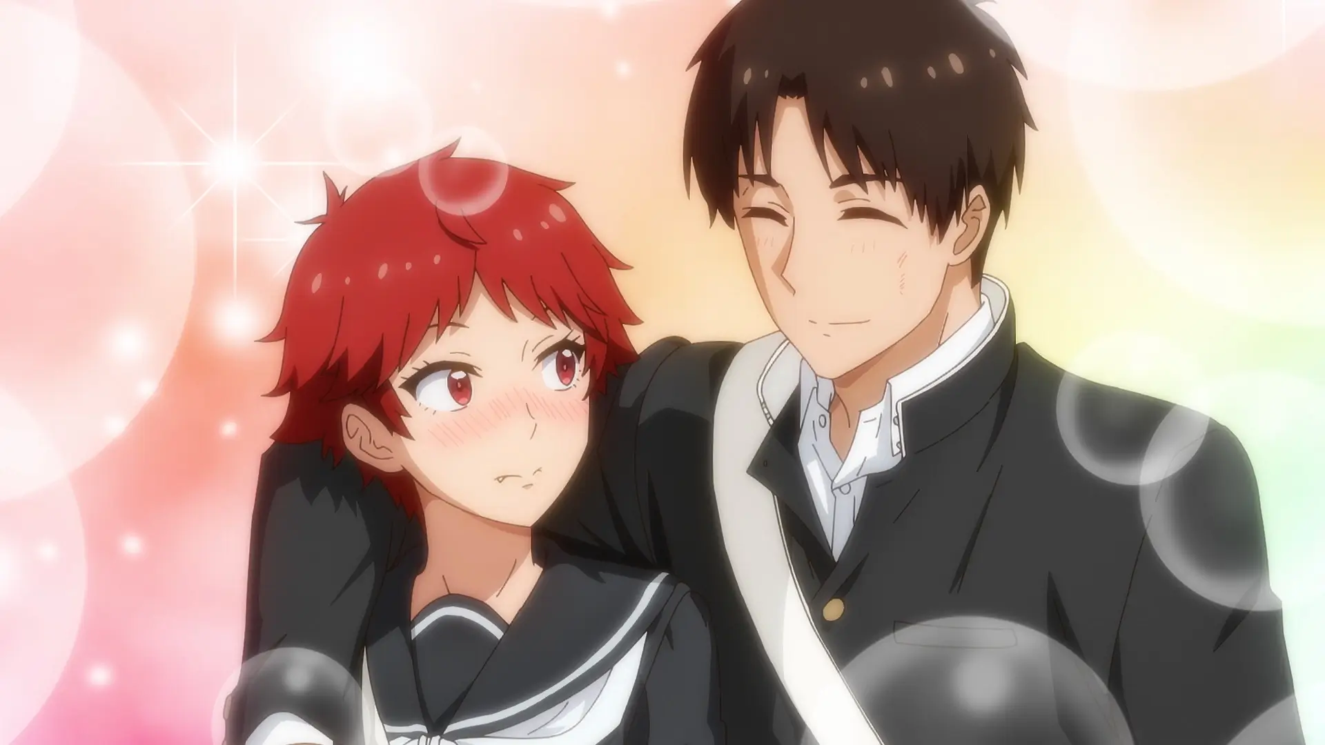 Tomo blushes as Junichirou smiles with his arm around her in Tomo-Chan is a Girl! romance anime