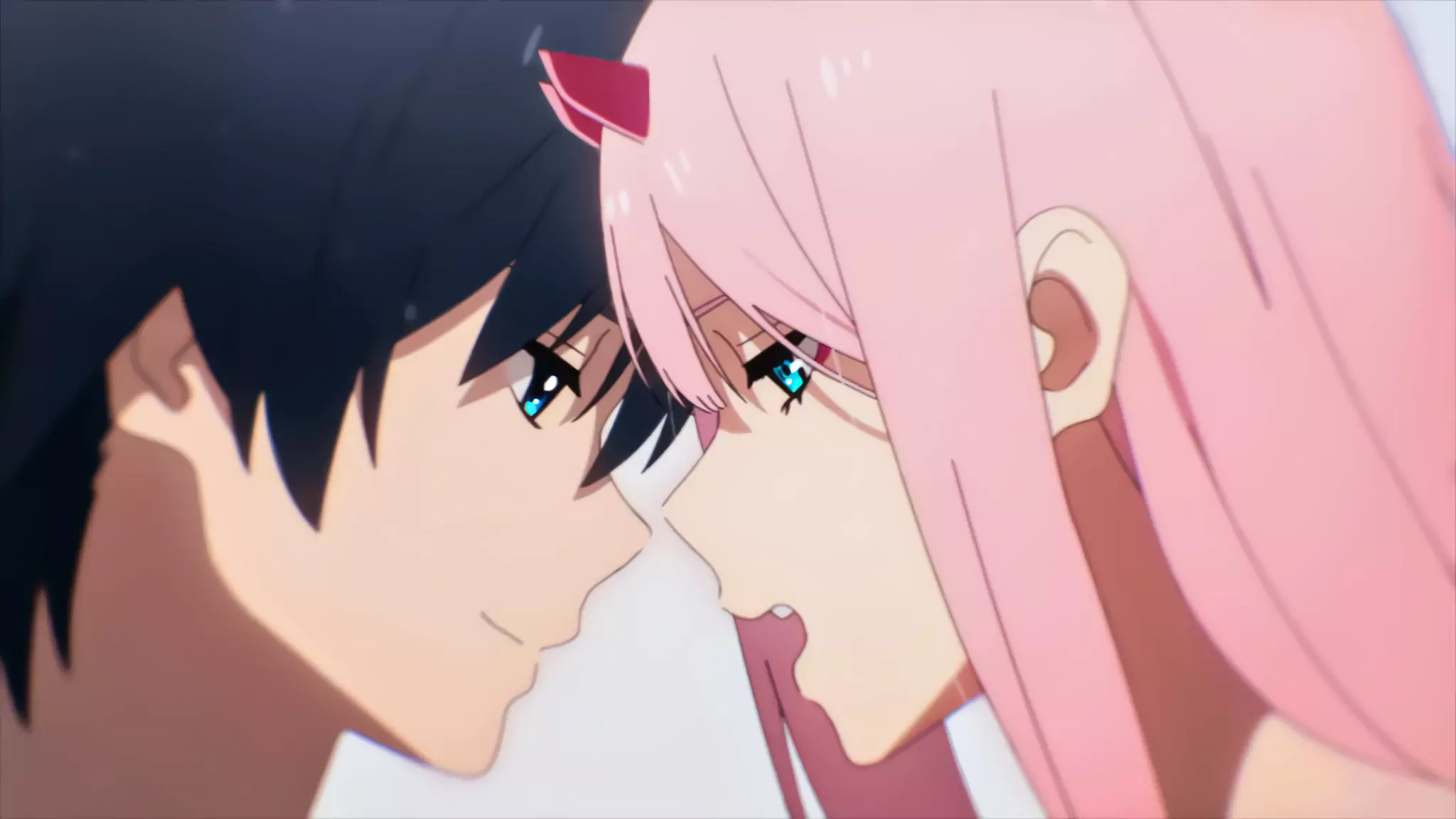 Hiro and Zero Two lean in close, their eyes locked in an iconic moment from the popular sci-fi romantic anime, Darling in the Franxx.