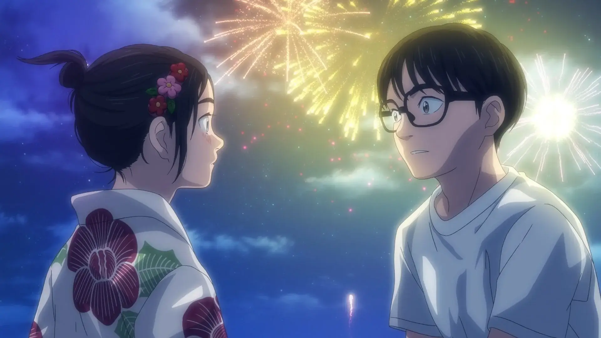 Nakami and Magari from the Insomniac After School anime share a heartfelt moment as colorful fireworks light up the night sky behind them.