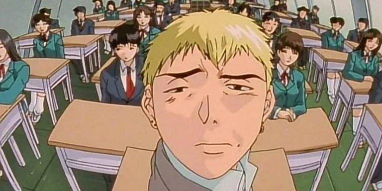 Protagonist of classic comedy anime, Onizuka smirking at the camera while seated in a classroom full of students.