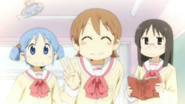 The main characters, Yuuko, Mio, and Mai from the comedy anime Nichijou, are smiling in class.