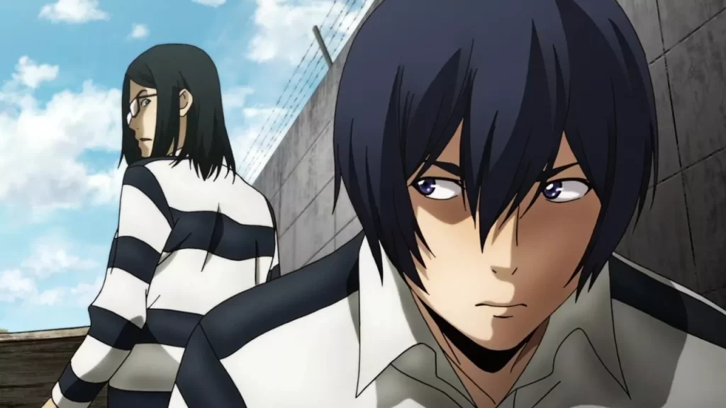 Characters from Prison School in prison uniforms exchange suspicious glances near a wall topped with barbed wire.