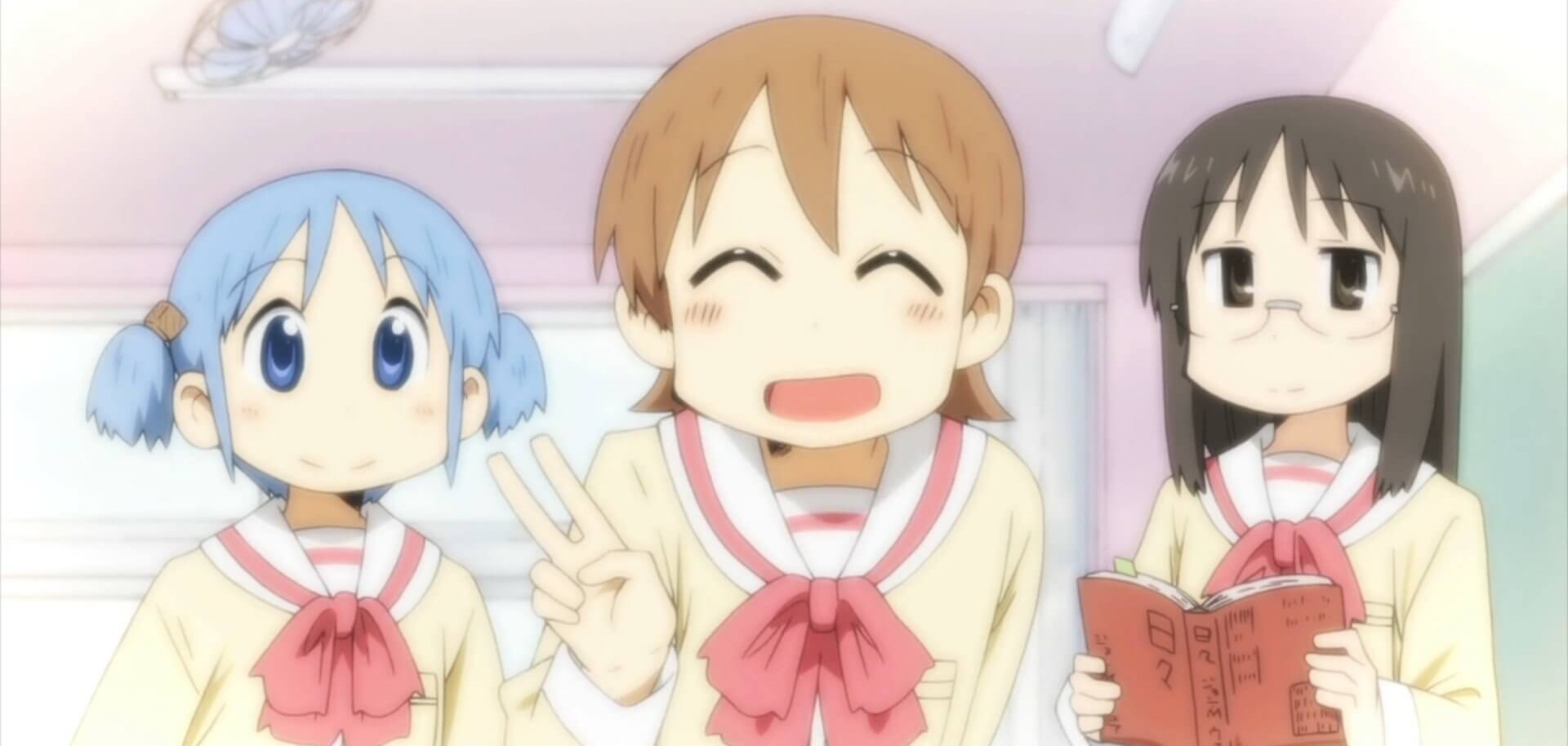 The main characters, Yuuko, Mio, and Mai from the comedy anime Nichijou, are smiling in class.