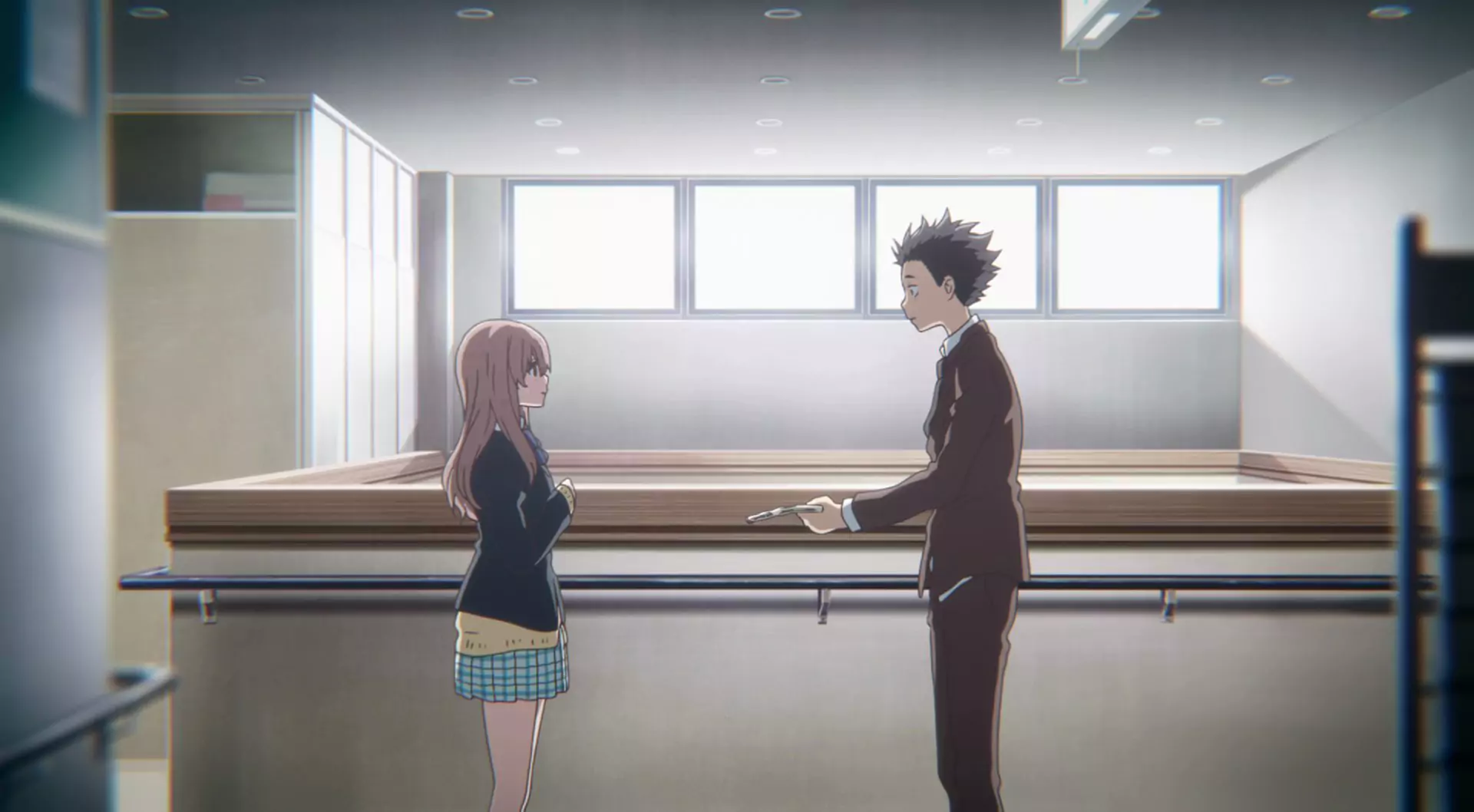 Shoya and Shoko share a quiet moment in A Silent Voice, highlighting the film’s emotional depth and reconciliation