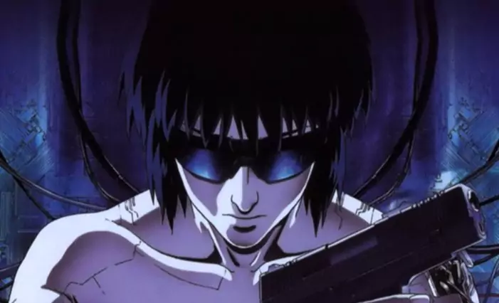Major Kusanagi prepares for battle in Ghost in the Shell, a groundbreaking cyberpunk movie exploring identity and AI.