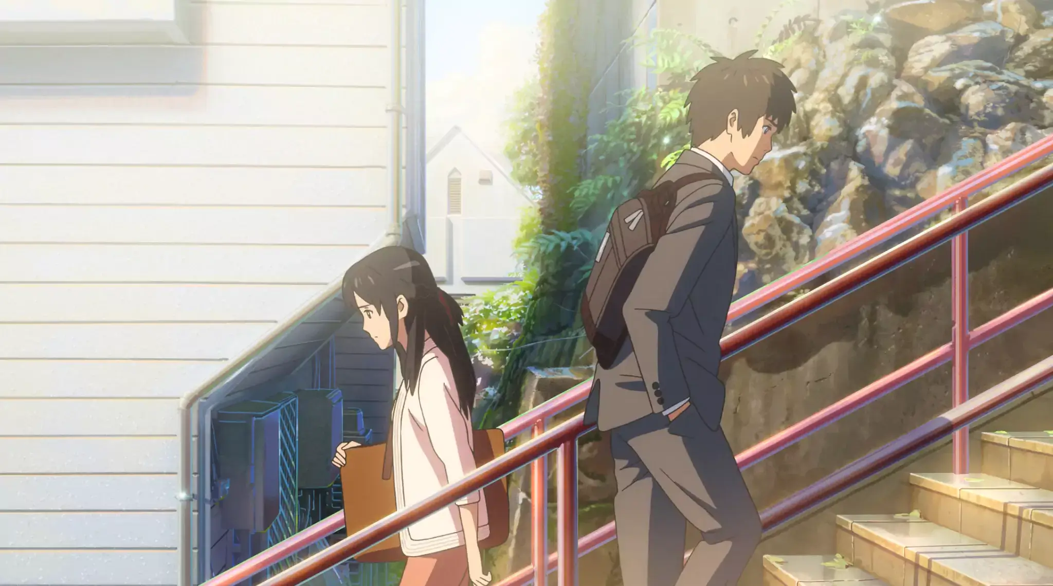 Taki and Mitsuha meet on a staircase in Your Name, a critically acclaimed anime movie by Makoto Shinkai.