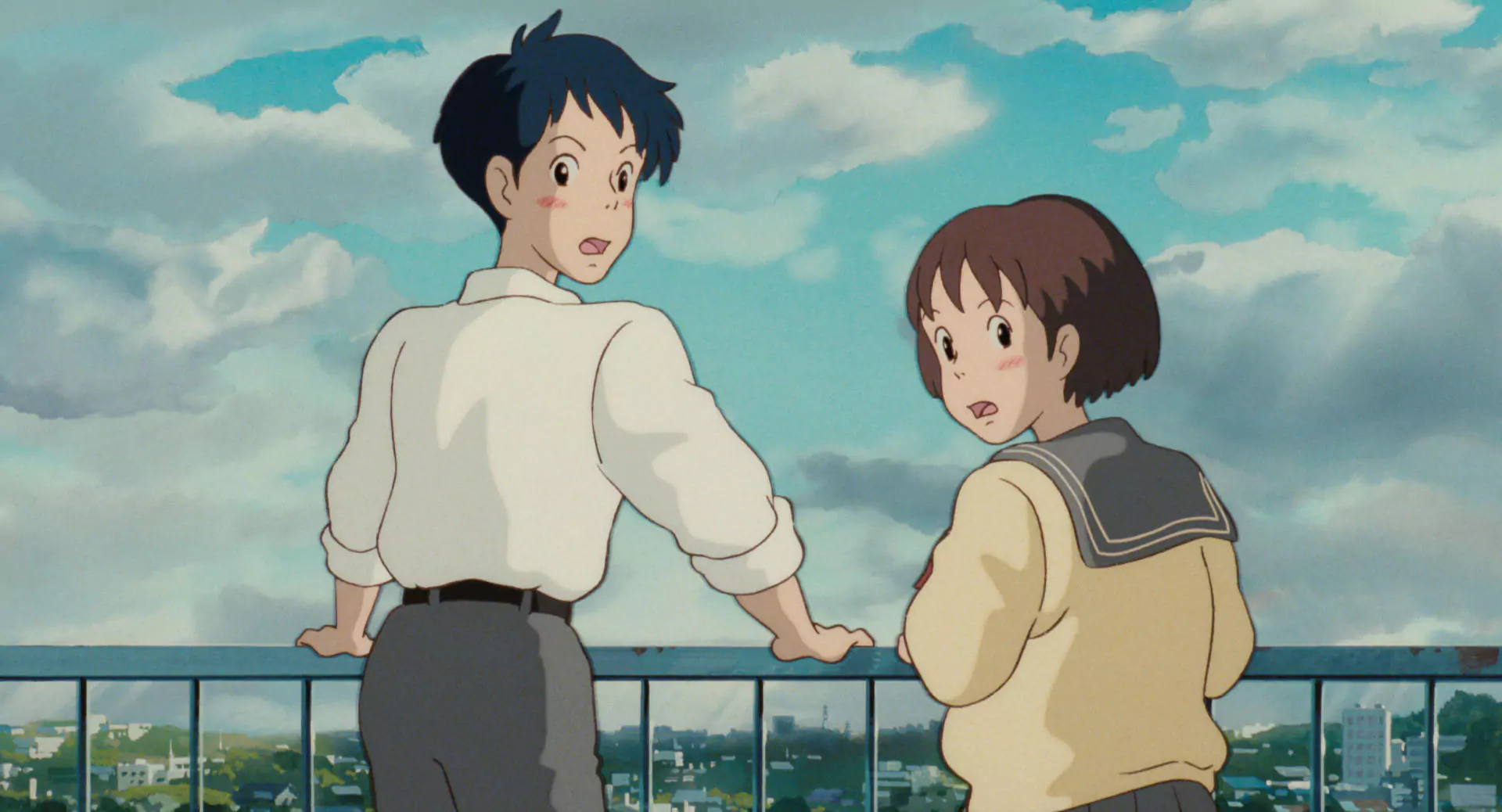 Shizuku and Seiji share a quiet rooftop moment in Whisper of the Heart, a beloved romance anime film.